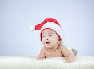 Christmas portrait of cute little Baby wearing santa hat.