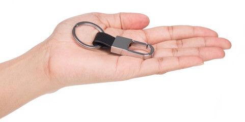 Hand holding Metal keychain with a small rectangle on a black strap isolated on a white background.