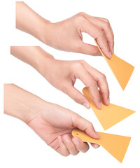 Set of Hand holding Yellow plastic scraper isolated on white background