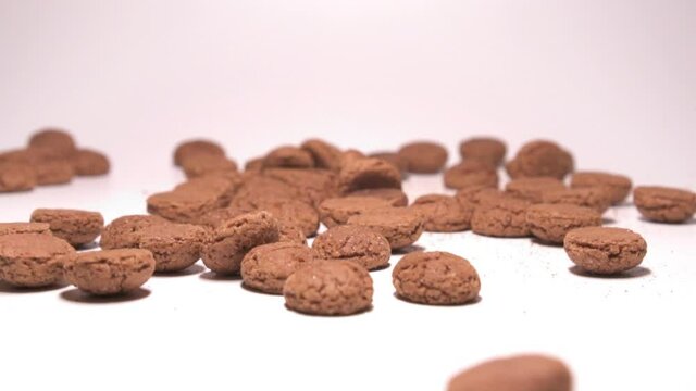 Dutch cookies: pepernoten. Sinterklaas candy. Slow motion shot.