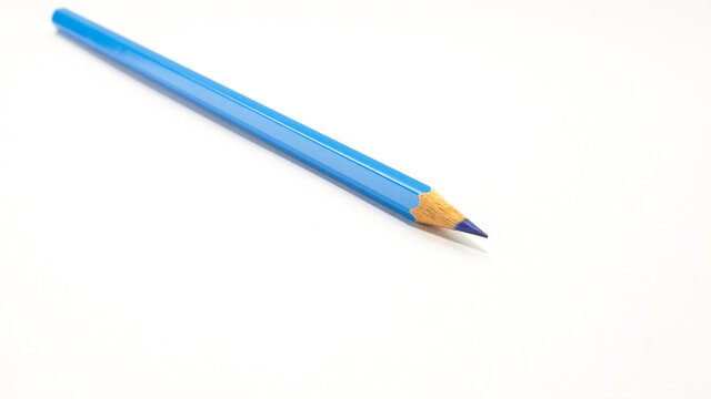 Colored pencils blue . Vibrant colors with  shiny arranged creatively on a white background.concept art design copy space school and office