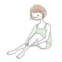 ふくらはぎのマッサージをする若い女性