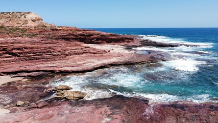 Red rocks into the ocean