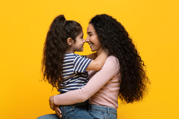 Love My Mommy. Cute Little Girl Bonding With Her Young Mom