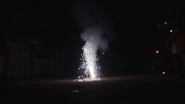 Slow motion shot of a cracker known as flower pot celebrating in Indian Diwali celebrations