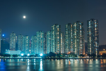 Full moon over residential district of Hong Kong City