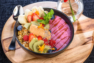 A healthy bowl of muesli and fruit for a colourful fresh breakfast