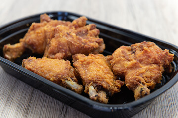 Crispy appetizer side order of deep fried chicken wings.