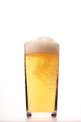 glass of fresh beer on white background isolated