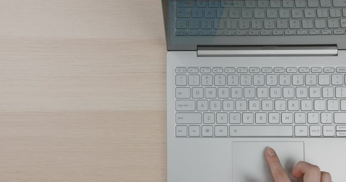 Office desk top view. Bright workplace with girl's hands, laptop. Flat lay. Copy space. Close-up.