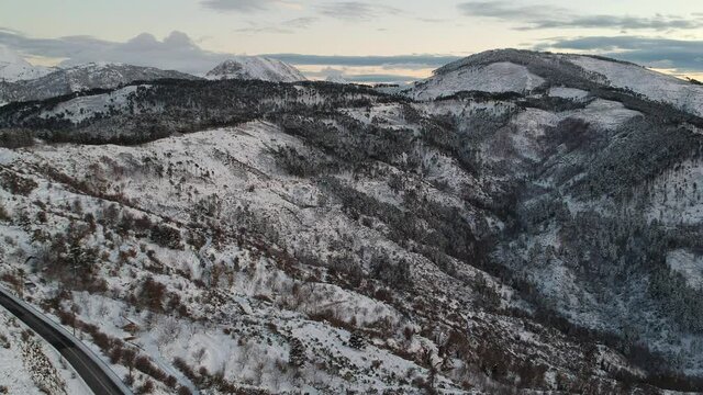 Aerial view of the snowy mountain Taygetus (also known as Taugetus or Taygetos) above Messenia unit in Peloponnese, Greece. Amazing natural scenery of the highest mountain in Peloponnese during winter