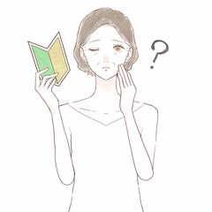 疑問を持っている初心者マークを持つ中年女性