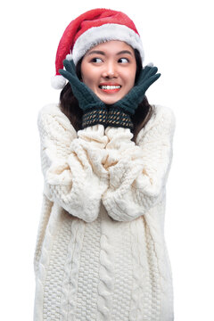 Asian woman with winter gloves and Santa hat