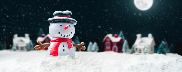 Concept - happy snowman at the north pole on Christmas night