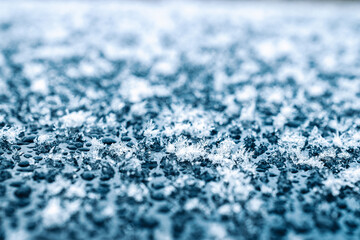 Frosting macro. Cold snow winter background. Blue crystal frozen abstract pattern. White frost ice texture.