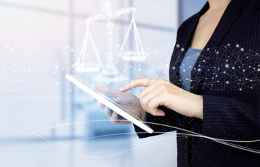 Labor Law Lawyer Legal Business. Hand touch white tablet with digital hologram Labor Law sign on light blurred background. Justice and law concept. Legal advice.