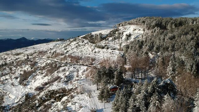 Aerial view of the snowy mountain Taygetus (also known as Taugetus or Taygetos) above Messenia unit in Peloponnese, Greece. Amazing natural scenery of the highest mountain in Peloponnese during winter