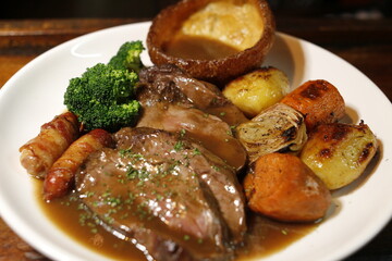 Sunday roast dinner lamb pork should with cracking meet