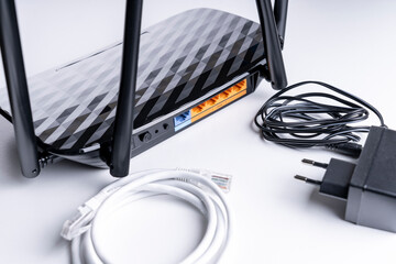 Wi-Fi router close-up, wireless Internet device close-up, selective focus, tinted image, wires...