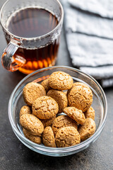 Amaretti biscuits. Sweet italian almond cookies and tea cup.