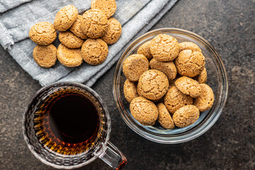 Amaretti biscuits. Sweet italian almond cookies and tea cup.
