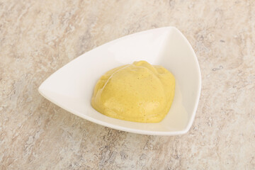 Organic mustard sauce in the bowl