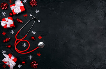 Christmas banner with festive decorations and medical stethoscope on black background.