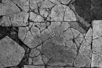 Old aged damaged marble bumpy uneven blocks. Trip pitted grunge granite tile cobble. Cragged grimy retro cranny frayed run track. Crannied dirtied shabby smashed gaping rustic big holes for 3d design