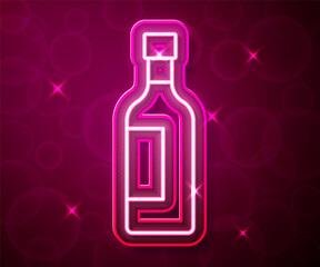 Glowing neon line Bottle of wine icon isolated on red background. Vector