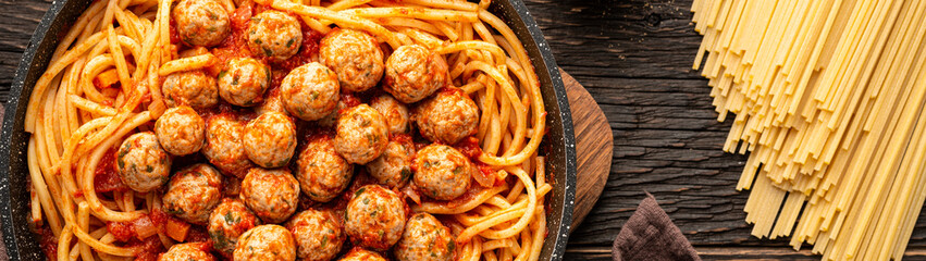 Frying pan SPAGHETTI MEATBALLS Like an Italian on wooden background banner