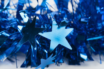 Blue Christmas tinsel with stars.
