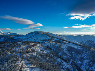 Aerial view of the snowy mountain Taygetus (also known as Taugetus or Taygetos) above Messenia unit in Peloponnese, Greece. Amazing natural scenery of the highest mountain in Peloponnese during winter