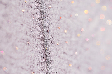 knitted lavender fabric with rhinestones. soft focus