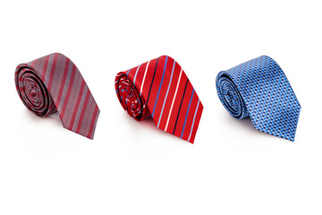 Set of men's ties of different colors on a white isolated background. Tie for a suit.
