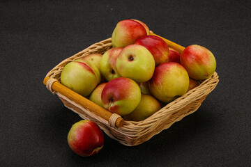 Sweet small nectarines in the basket