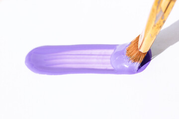 lilac brush stroke on white sheet of paper