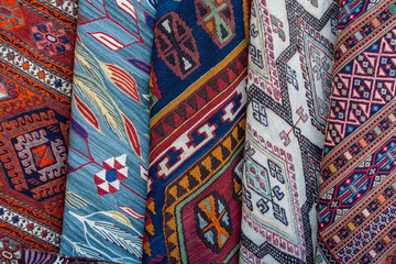 Traditional carpets for sell at a street market stall in Turkey