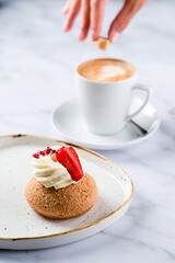 Close-up of Shu cream Japanese cream puff and hot coffee. Concept sweets enjoy eating.
