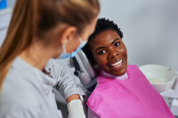 Fototapeta premium Smiling patient and dentist in office