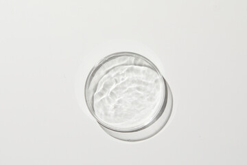 Petri dish with ripple in grey background