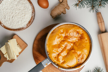 Step-by-step tutorial on baking Christmas gingerbread cookies. Step 5: Stir until reaction is completely gone. Top view