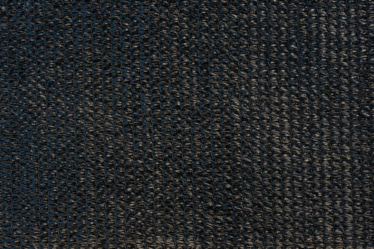 Black slan mesh used as background.Black net