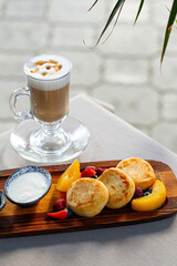 Sweet breakfast with cottage cheese pancakes and latte