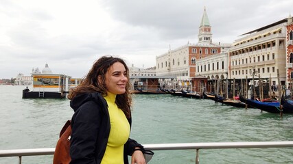 Fototapeta na wymiar Lady woman tourist by boat ferry watch the beauty of the city of the city of love in the Grand Canal Venice