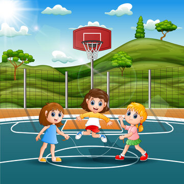 Three girls playing jump rope in the field