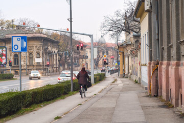 Traffic on the asphalt road in the historic center of Subotica city, Serbia