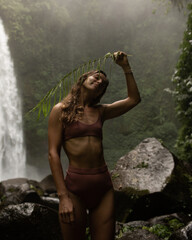 portrait of a women on a background of the jungle.