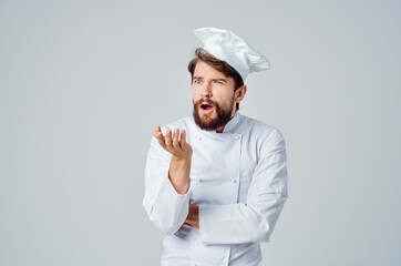 bearded man Chef uniform Cooking emotions light background