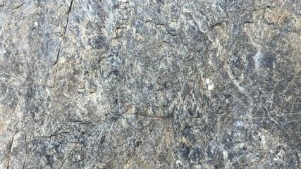An old stone blur with beautiful streaks, colored in brown, yellow, blue, white and black as...