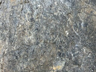 An old stone blur with beautiful streaks, colored in brown, yellow, blue, white and black as wallpaper themes.